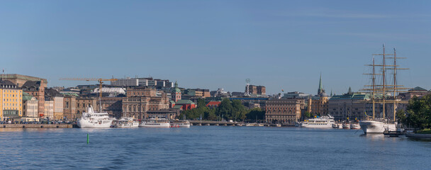 Fototapeta na wymiar The bay Saltsjön, piers, the old town Gamla Stan, the garden Kungsträdgården, office houses, steam ships and museums a summer day in Stockholm