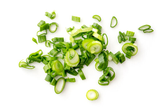 Chopped stems of green onion or chives isolated on white, top view.