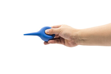 A hand holds a blue rubber blowing dust ball isolated on a white background