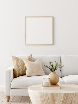 Light brown square wooden frame mockup in living room interior with sofa on white background. 3D rendering, illustration.