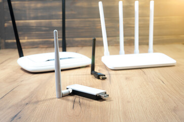 Different types of Wi-Fi routers, modern and old technology. Wireless ethernet connection signal. USB Wifi Receiver Wireless Network Card. High Speed Antenna Wifi Adapters.