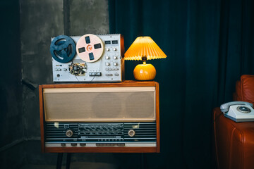 Vintage room with Wiretapping on the reel tape recorder. Retro old school spying on conversations. Intelligence gathering. Espionage concept. - obrazy, fototapety, plakaty
