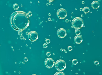 Turquoise water. Underwater. Bubbles in the water. Macro