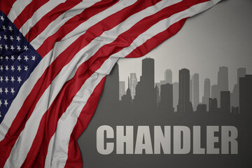 abstract silhouette of the city with text Chandler near waving national flag of united states of america on a gray background.