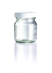 Empty clear glass jar, white cap in front view, and reflection isolated on white background, Suitable for Mock up creative graphic design, clipping path.