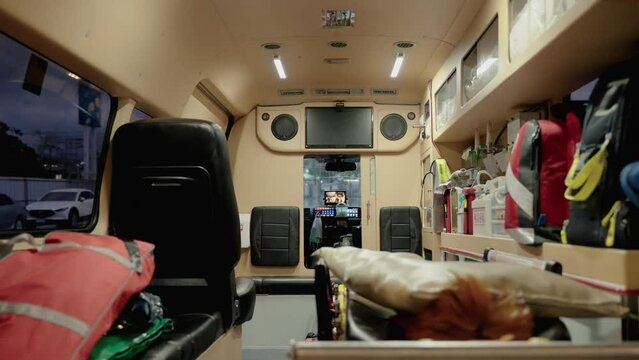 Inside of an ambulance with resuscitation equipment and first aid
