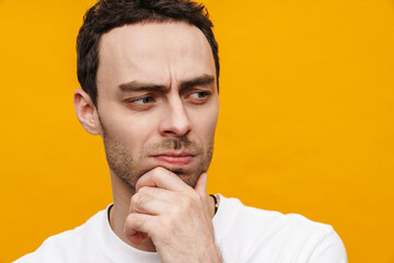 Mid aged brunette casual man in t-shirt standing isolated