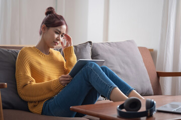 relax, de-stress, holiday, happy, Asian woman relaxing at home listening to music from smartphone and laptop happily.