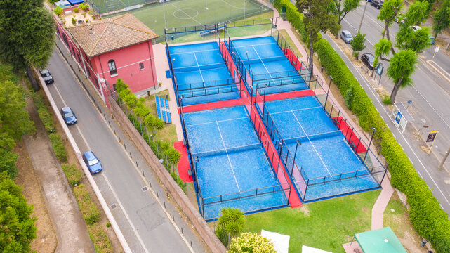 Aerial view on four padel courts in Italy.