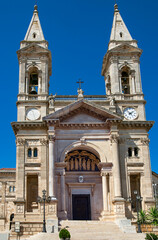 Fototapeta na wymiar Amazing view of the cathedral Basilica of Saints Cosmas and Damian in Alberobello village, Italy.