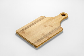 Wooden cutting board on white background