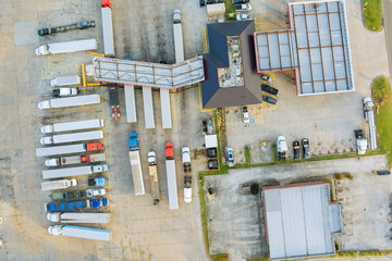 Top view from an aerial perspective of fuel stations near the highway for vehicles, trucks, and diesel fuel