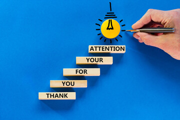 Thank you for attention symbol. Concept words Thank you for your attention on wooden blocks on a beautiful blue table blue background. Businessman hand. Business and thank you for attention concept. - obrazy, fototapety, plakaty