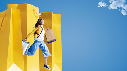Cheerful woman shopping and big shopping bags