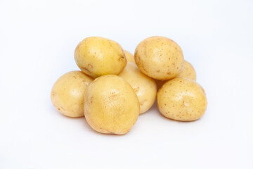 Young rustic raw potato on white background
