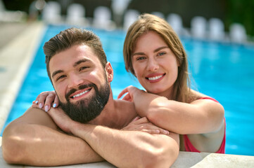 Romantic couple posing for the camera in the water