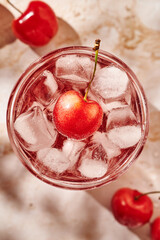 refreshing lemonade with ice and cherries