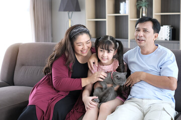 happy family lifestyle concept Cheerful people sitting on couch in living room have fun little...