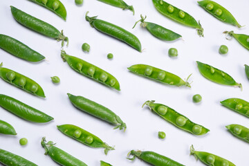 young green peas on white background, healthy food concept, trendy vegetable background