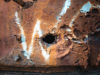 War in Ukraine, pierced armor, a hole in the armor of a tank turret, a tank turret damaged by shrapnel