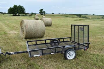 Metal Trailer by Hay Bales in a Farm Field