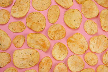 Pink background with potato chips close up .fashion,food background 