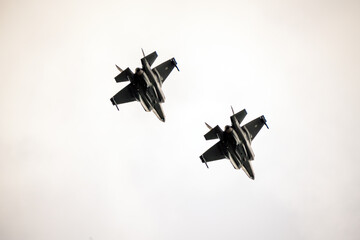 Two american f 35 fighter jets training up in the sky. Defense and war concept.