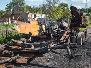 The war in Ukraine, the destroyed tank, the remains of the tank are on the side of the road, front view