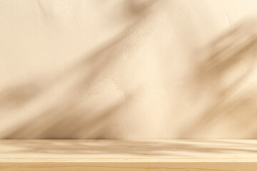 Wooden table mockup on stucco  beigebackground with branch shadows on the wall. Mock up for...