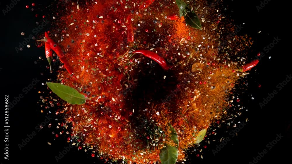 Poster super slow motion of rotating spices mix on black background. ultimate realistic twister motion, stu