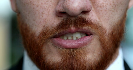 Obraz premium Angry man emotion, close-up person lips and mouth changing mood becoming upset and furious, face portrait redhead