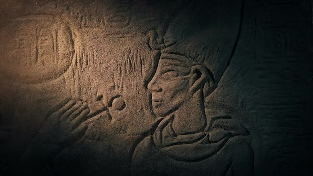 Flashlight Lights Up Pharaoh Rock Carving
