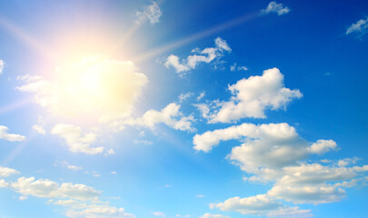 Naklejka na ściany i meble blue sky with white clouds and sun.