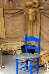Nice blue chair in a traditional wicker artisan workshop