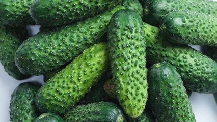 Fresh green cucombers as a background