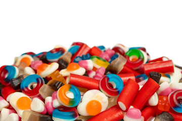 Tasty mix of jelly colorful candies isolated on a white background.