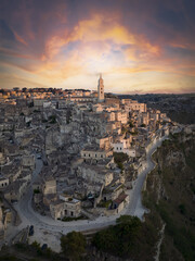 Fototapeta na wymiar View from above, stunning aerial view of the Matera’s skyline during a beautiful sunrise. Matera is a city on a rocky outcrop in the region of Basilicata, in southern Italy..
