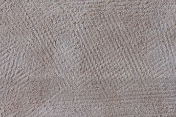 Obraz premium Grey, beige grainy textured background. Scalloped plastered wall texture. Ribbed plaster pattern. 