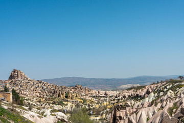 Fototapeta na wymiar Uchisar panorama with Uchisar castle and rock formations, Cappadocia, Nevsehir, Turkey. Popular travel destination. Copy space for text.