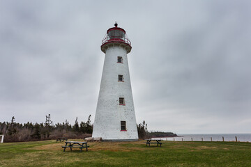 Fototapeta na wymiar Point Prim Light house, Northumberland Strait, Belfast, Prince Edward Islands. Built in 1845, a National Heritage site, is the first and oldest lighthouse in PEI. 
