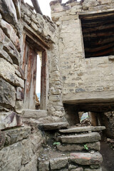 details of old ruined stone houses on the street in abandoned mountain village Old Koroda in Dagestan, Russia