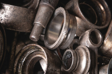 Old clips from automotive bearings. Metal scrap in shallow depth of field. Metal waste