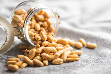 Roasted peeled peanuts in jar.