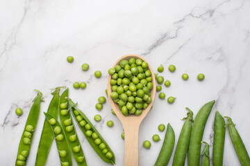 fresh green peas on a white isolated background
