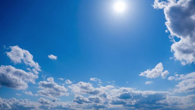 Time lapse of layered clouds move in the blue sky under bright sun. Cirrus clouds change shape and dissolve in cloud space. Majestic fluffy sky. Cloudscape timelapse. Change weather. Amazing nature 4K
