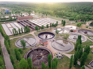 Aerial view of wastewater treatment plant at sunset, filtration of dirty or sewage water