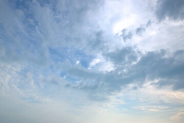 Obraz premium Beautiful fluffy white clouds float across the blue sky. Background. Banner. Screensaver on the monitor.