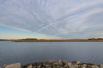 Ocean and sky with fishing boat at sunset
