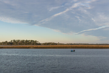 Two people fishing from a boat