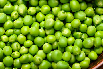 green peas in detail as a background, the concept of fresh vegetables and healthy food